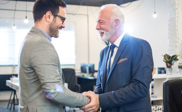 two gentleman shaking hands