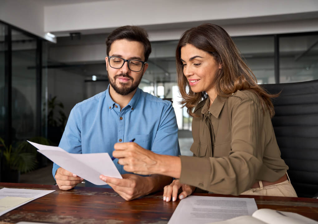 two business advisors reviewing document