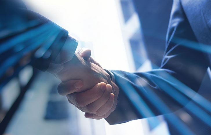 two business advisors shaking hands